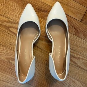White pointed toe pumps